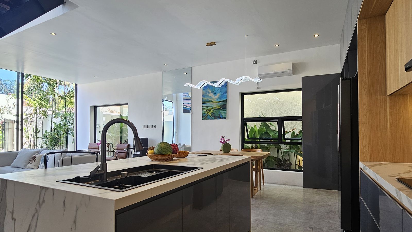 Marble island and timber detail at La Tiara Canggu